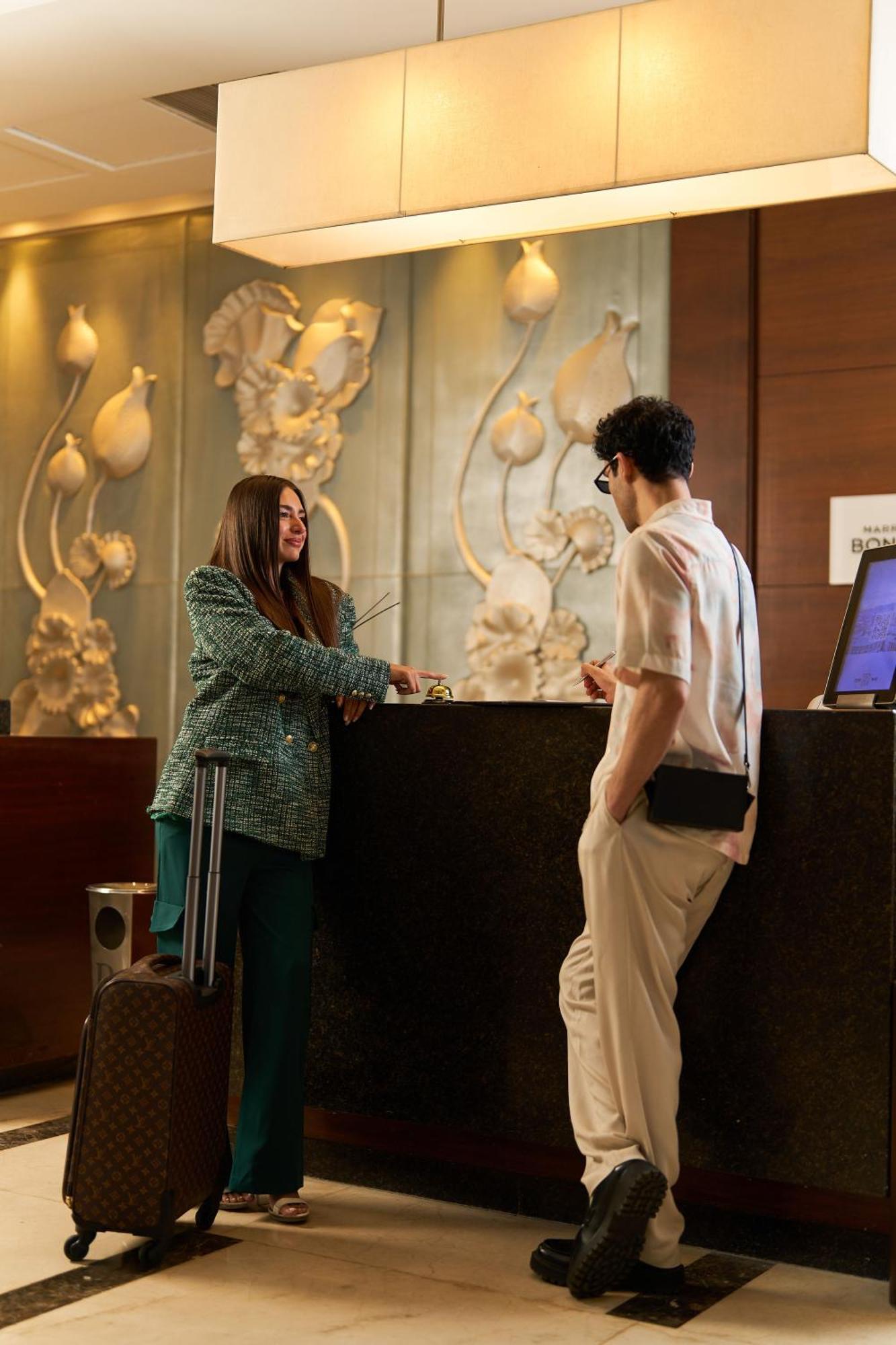 Renaissance Cairo Mirage City Hotel Экстерьер фото A hotel receptionist